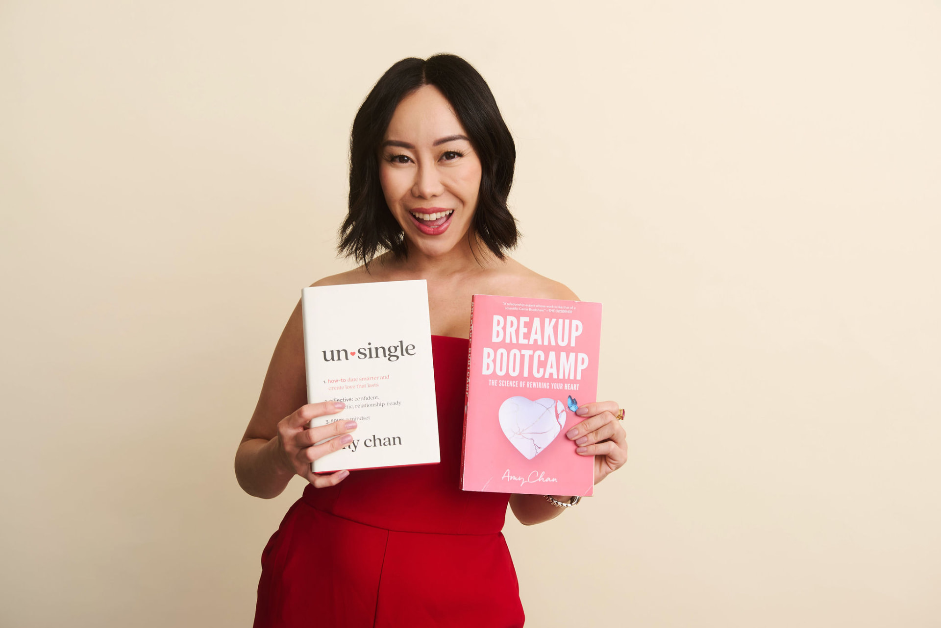 Amy Chan holding her new book Unsingle